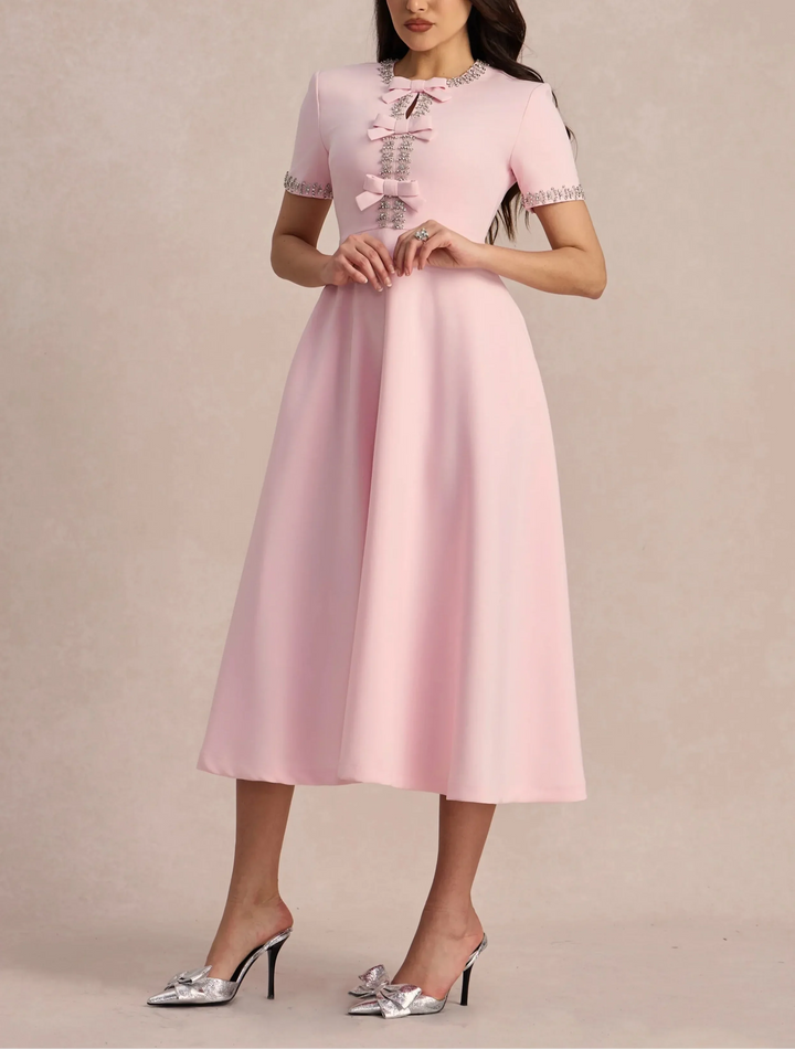 Raffaella | Flared dress with bows and beads