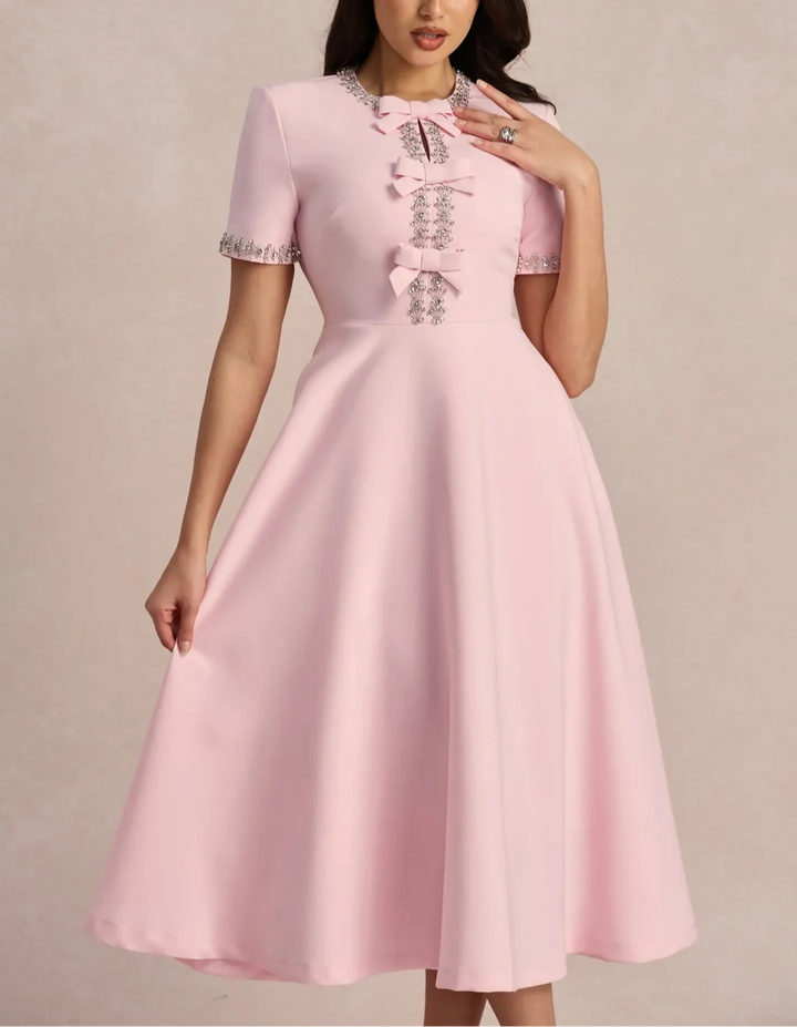 Raffaella | Flared dress with bows and beads