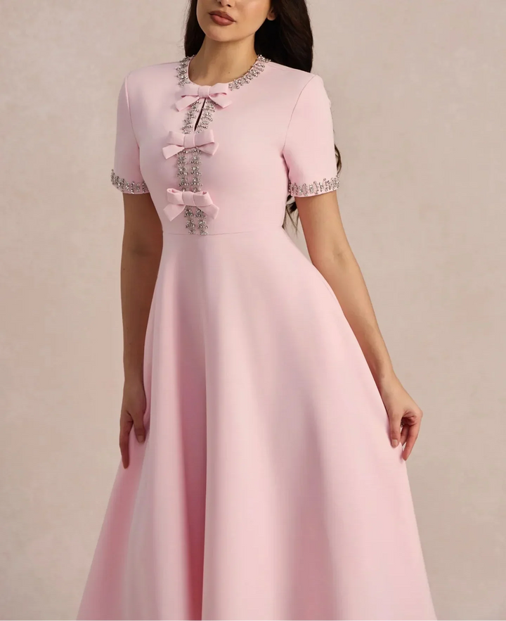 Raffaella | Flared dress with bows and beads