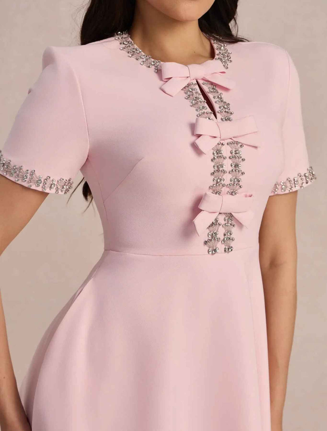 Raffaella | Flared dress with bows and beads