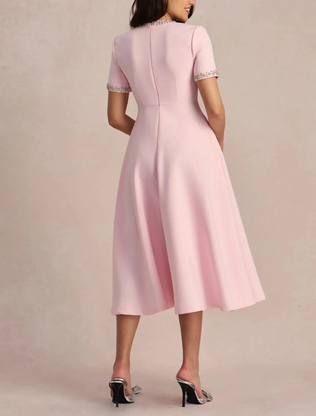 Raffaella | Flared dress with bows and beads