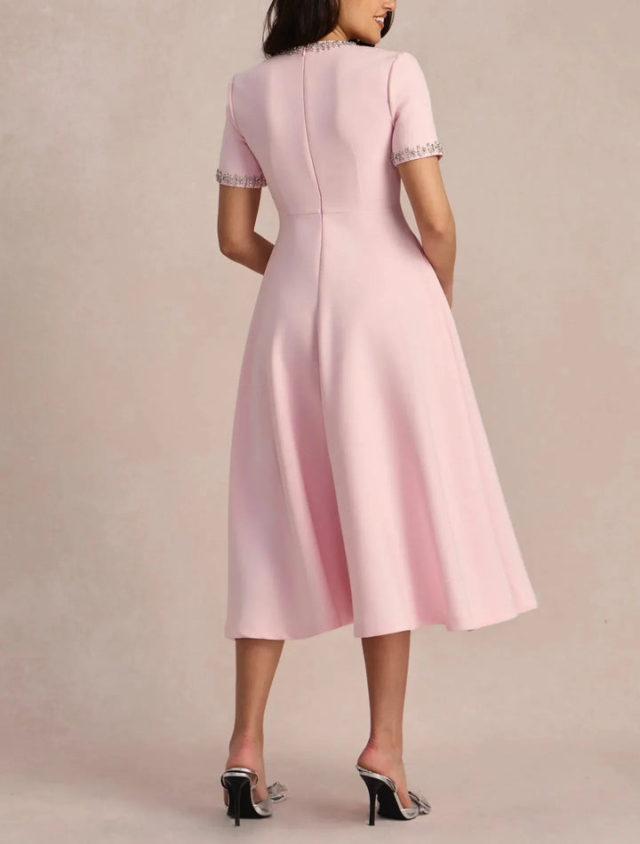 Raffaella | Flared dress with bows and beads