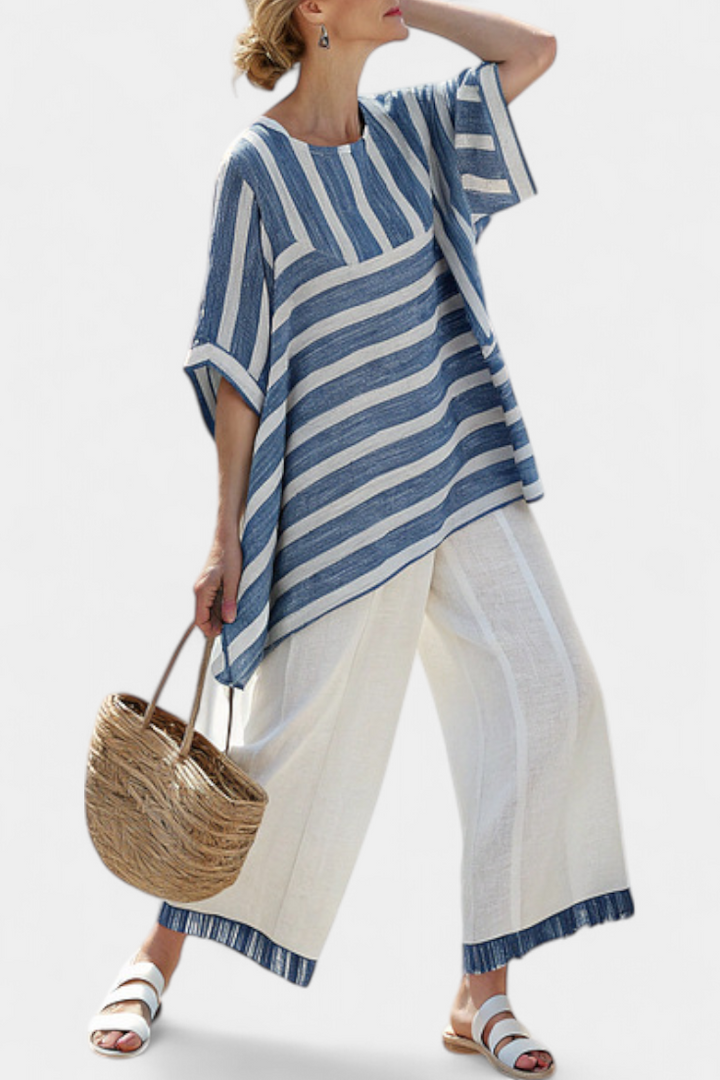 Elegant Mediterranean linen set with blue stripes and hem-finish trousers for a fresh, elegant look