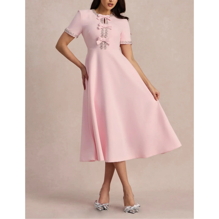 Raffaella | Flared dress with bows and beads