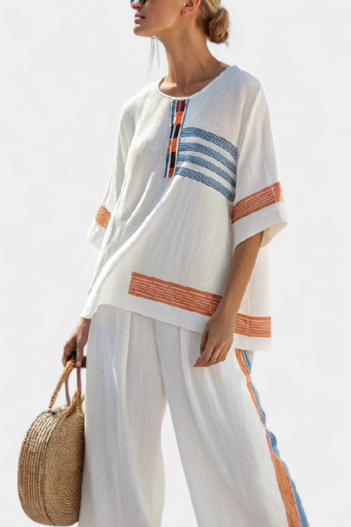 Daisy ethnic outfit in white with blue and orange stripe details – unique, vibrant style