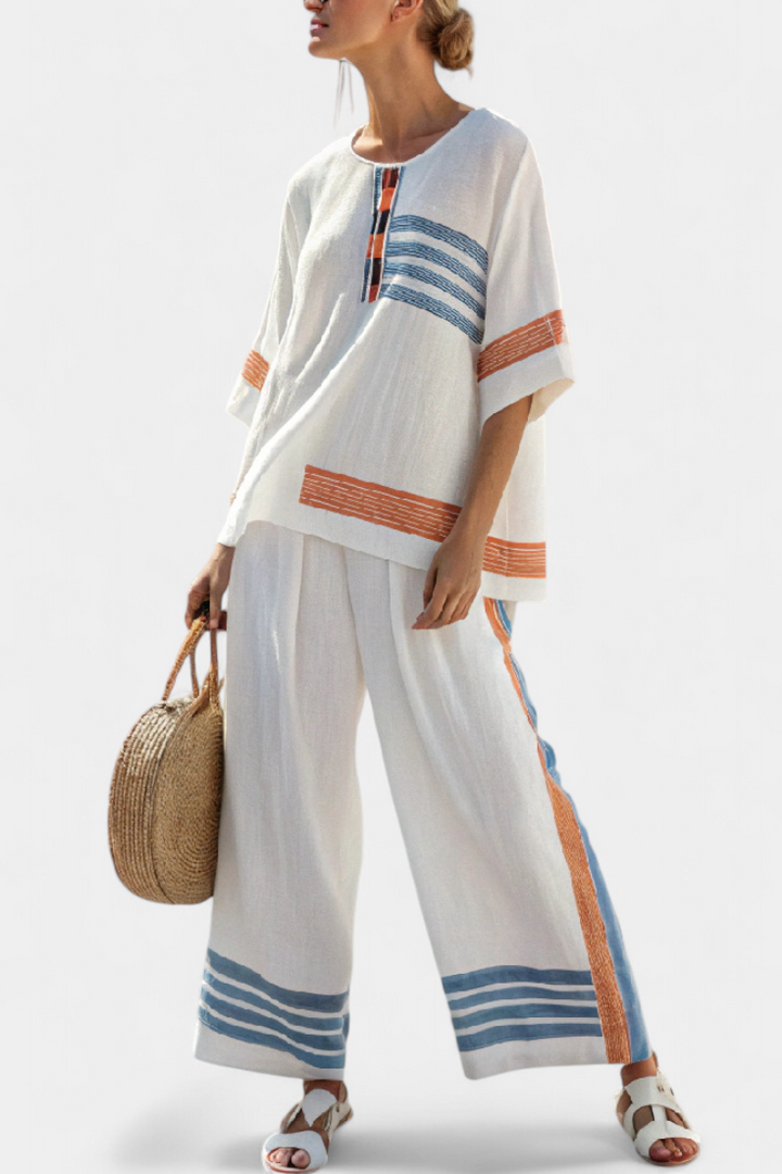 Daisy ethnic outfit in white with blue and orange stripe details – unique, vibrant style
