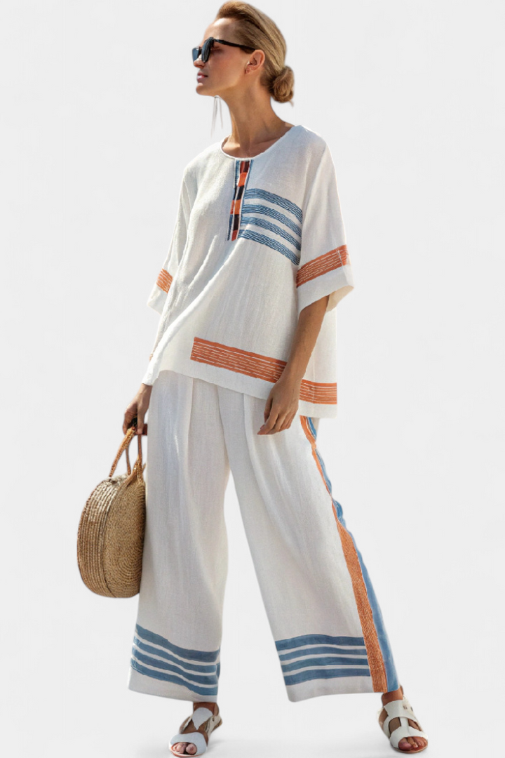 Daisy ethnic outfit in white with blue and orange stripe details – unique, vibrant style